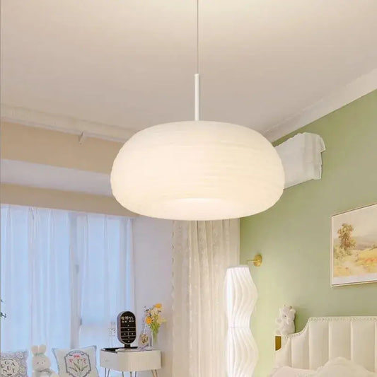 Soft cream apple paper pendant light with cloud-like shape hanging from white rod by decorbites cream apple