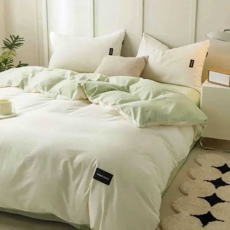 Soft cream cotton bedding set with soft mint green and white duvet featuring subtle texture and black brand tag decorbites cotton bedding
