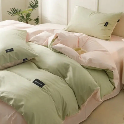 Pastel green and pink decorbites cotton bedding set with soft cream cotton fabric and subtle black brand tags