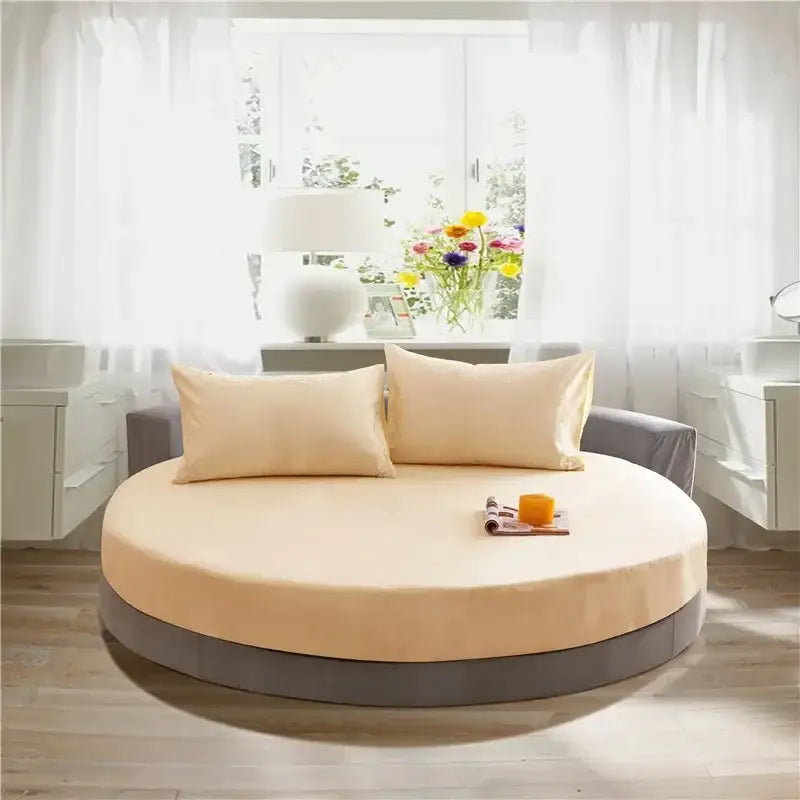 Soft dark gray cotton round bed sheet set on round bed with beige mattress and matching pillows decorbites cotton round