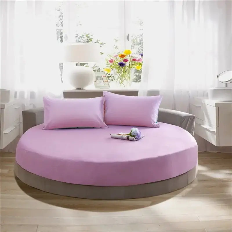 Soft dark gray cotton round bed sheet set featuring a pink round bed with matching pillowcases for decorbites cotton round bedding