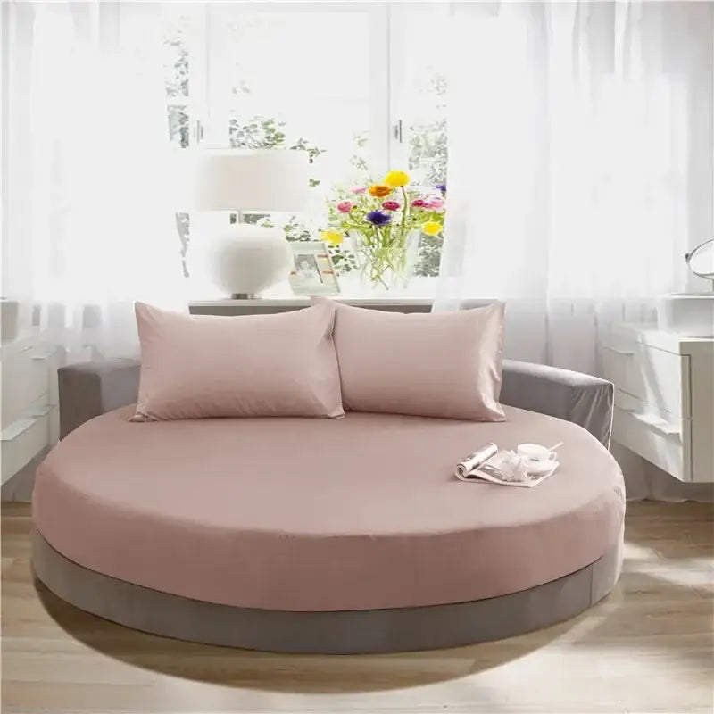 Soft dark gray cotton round bed sheet set with a soft pink fabric cotton round bed and matching pillows by decorbites