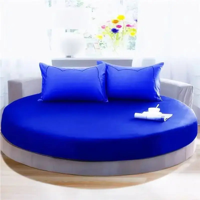 Vibrant royal blue cotton round bed with matching pillowcases and sleek gray base from decorbites cotton round sheet set
