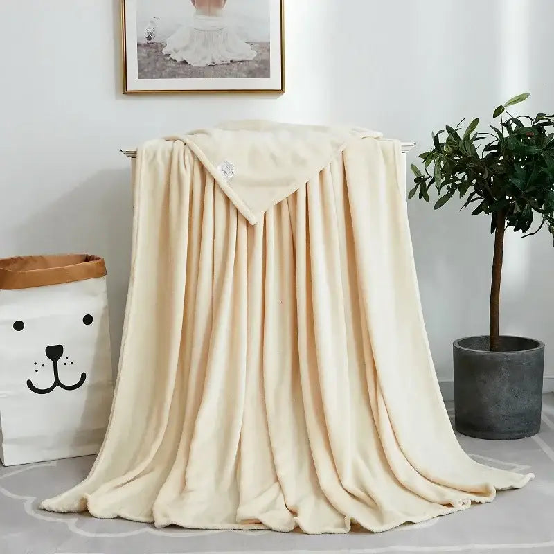 Cream-colored plush blanket with soft velvety texture and subtle sheen for decorbites cozy flannel warm bedding