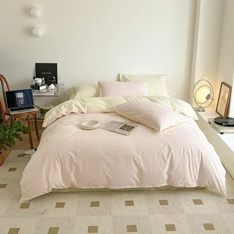 Soft lavender cotton queen bedding set with pastel pink duvet and matching pillows in smooth satin finish fabric