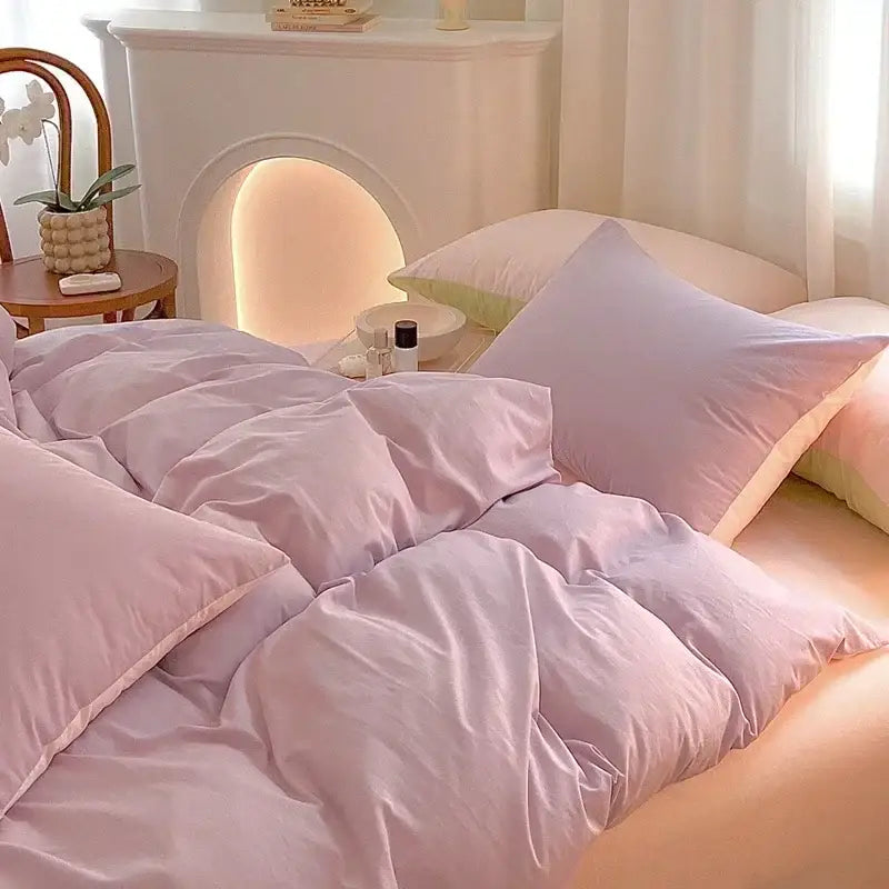 Soft lavender cotton queen bedding set with quilted comforter and matching pillowcases featuring plush texture
