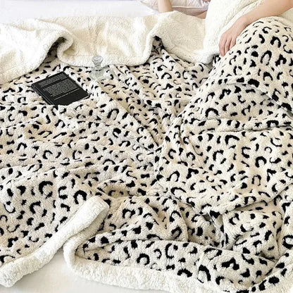 Cream-colored plush wool blanket with black leopard print double layered soft fuzzy texture perfect decorbites leopard print throw