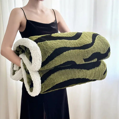 Soft leopard print double layered wool blanket with olive green and black stripes and plush white sherpa lining