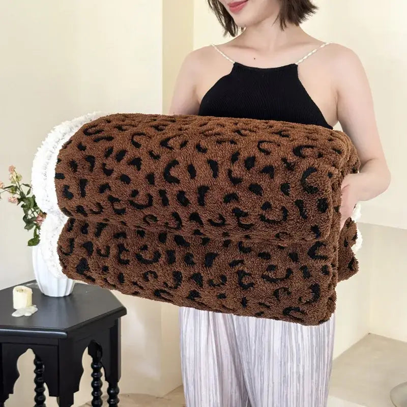 A soft brown leopard print double layered wool blanket with a textured surface for cozy bedroom decorbites leopard print