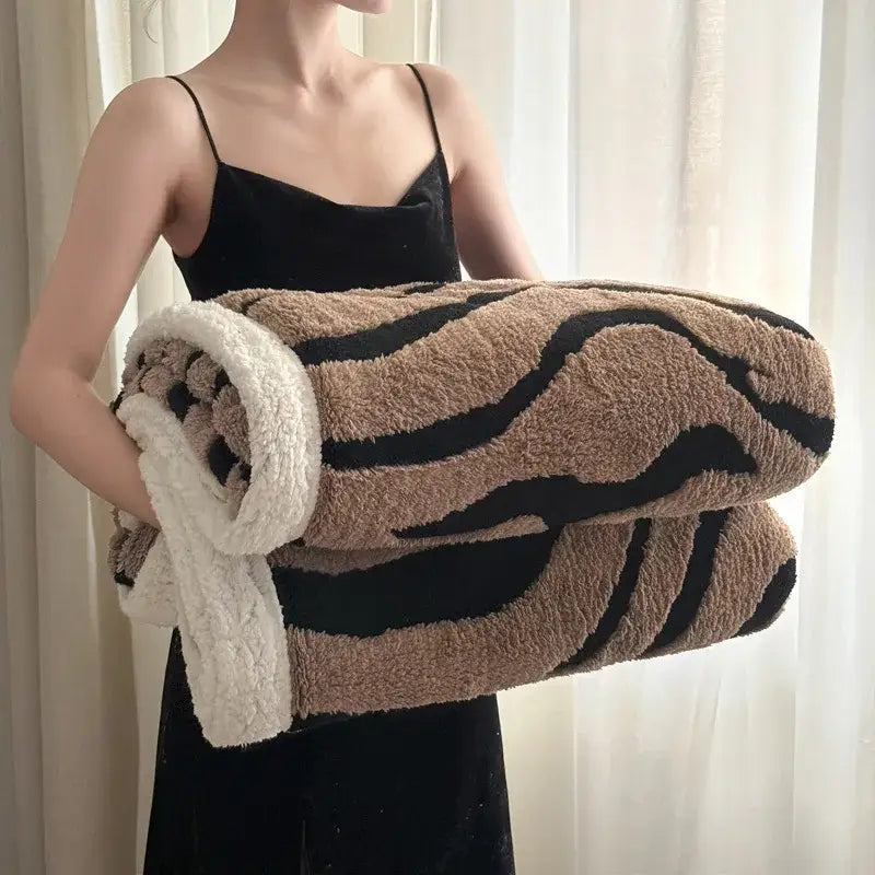 Soft leopard print double layered wool blanket in tan and black with a white fleece lining for cozy decorbites leopard print decor