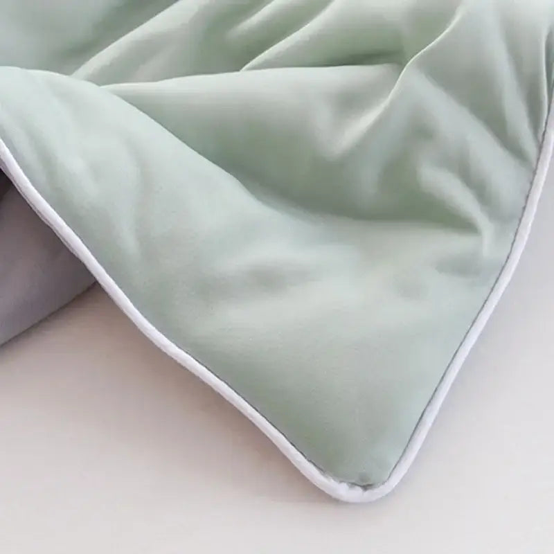 Soft mint green velvet decorbites cooling quilt with white stitched border for bedroom quilted comforter use