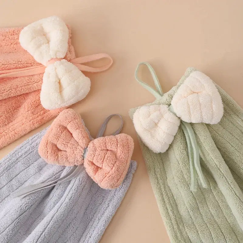 Soft pastel bowknot microfiber hand towels in peach lavender and mint green with plush terry cloth for kitchen and bathroom use
