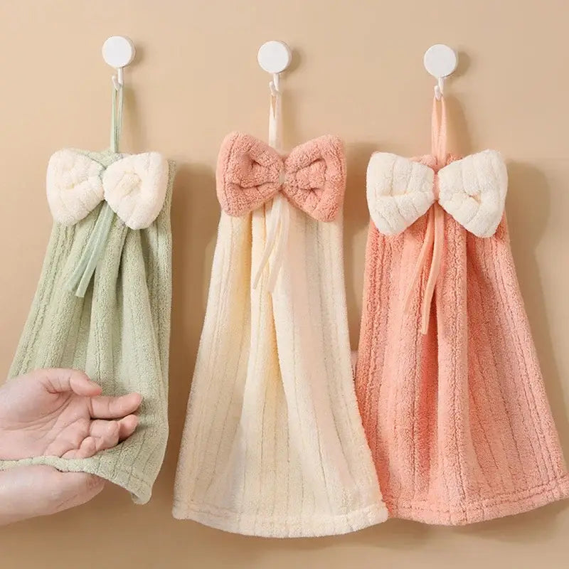 Three pastel-colored decorbites bowknot microfiber hand towels with plush bows made of soft terry cloth for kitchen and bathroom use
