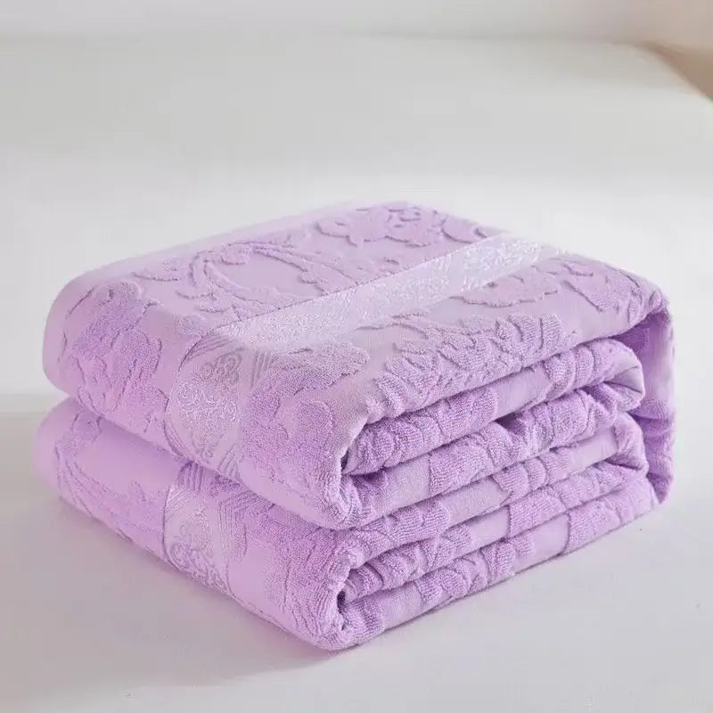 Soft pastel lavender decorbites cotton jacquard towel blanket with raised floral pattern and shimmering stripe for bedroom decor