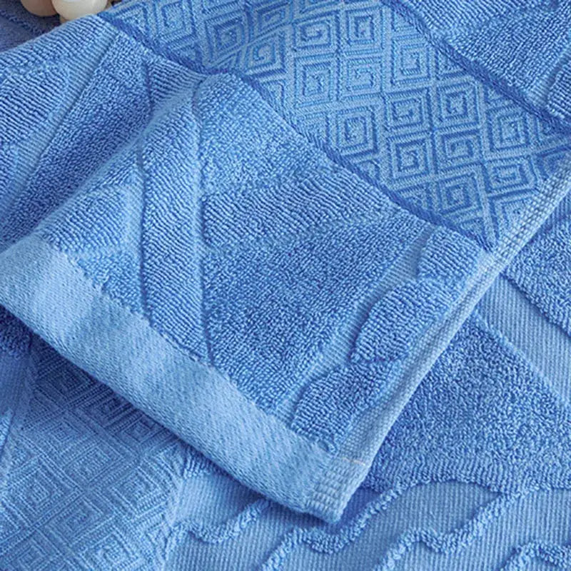 Soft pastel light blue decorbites cotton jacquard towel blanket with textured woven geometric pattern and terry cloth finish