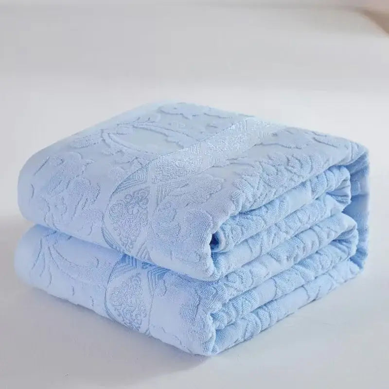 Soft pastel light blue decorbites cotton jacquard towel blanket with subtle floral pattern for bedroom and sofa decor