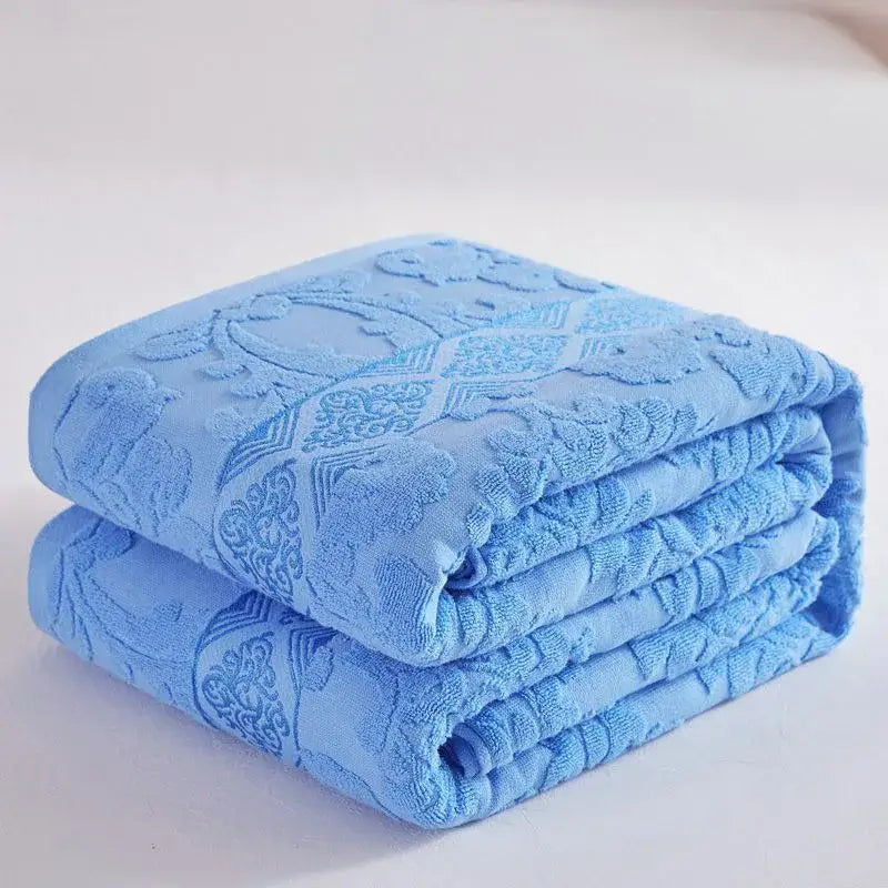Soft pastel light blue decorbites cotton jacquard towel blanket with raised floral geometric pattern for bedroom and sofa decor