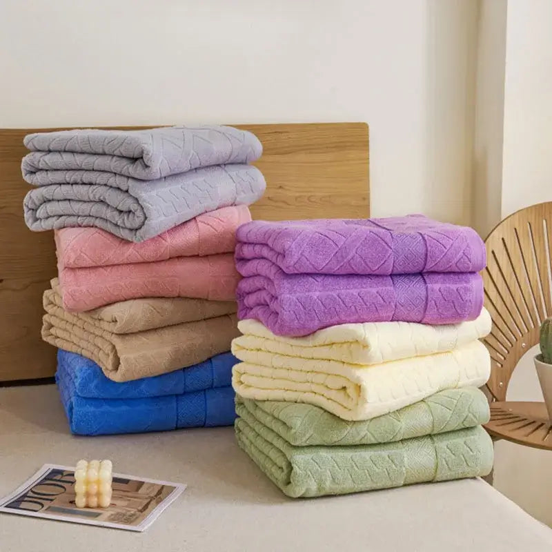 Stacks of soft pastel cotton jacquard towels in lavender pink beige blue cream and sage green for decorbites jacquard towel blanket