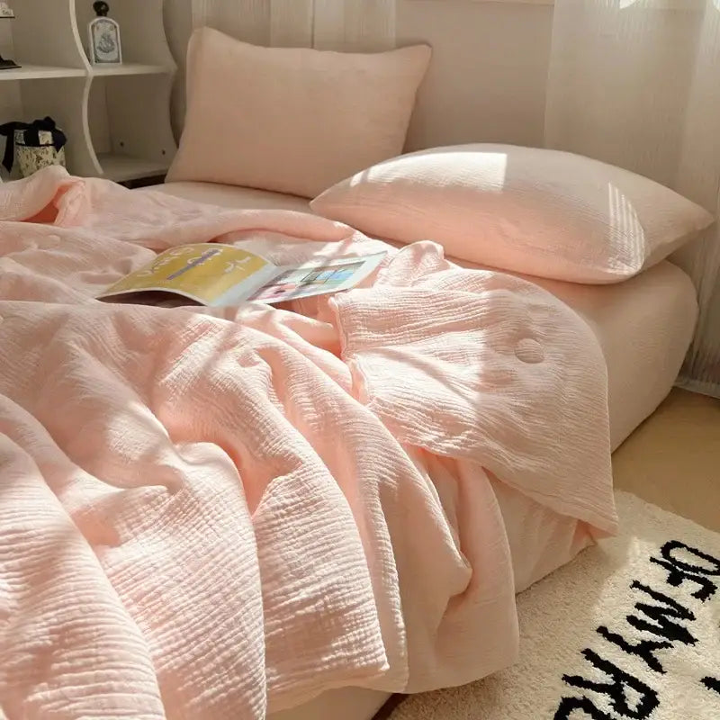 Soft blush pink cotton muslin duvet cover with subtle textured weave in decorbites cooling wrinkled yarn quilt style