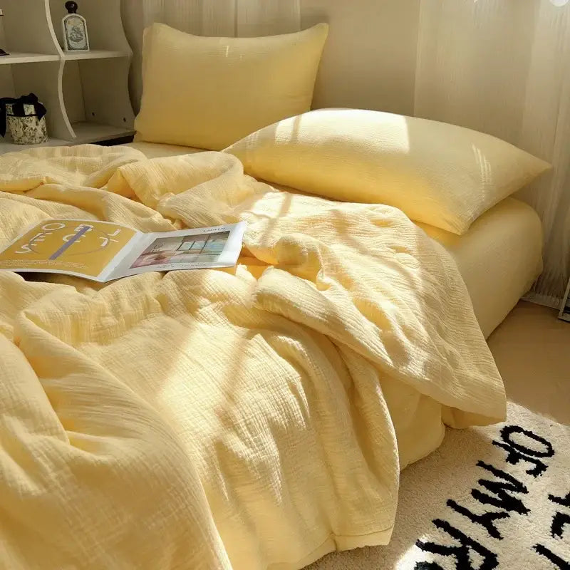Soft pale yellow cotton muslin duvet set with subtle textured weave featuring decorbites cooling wrinkled yarn design