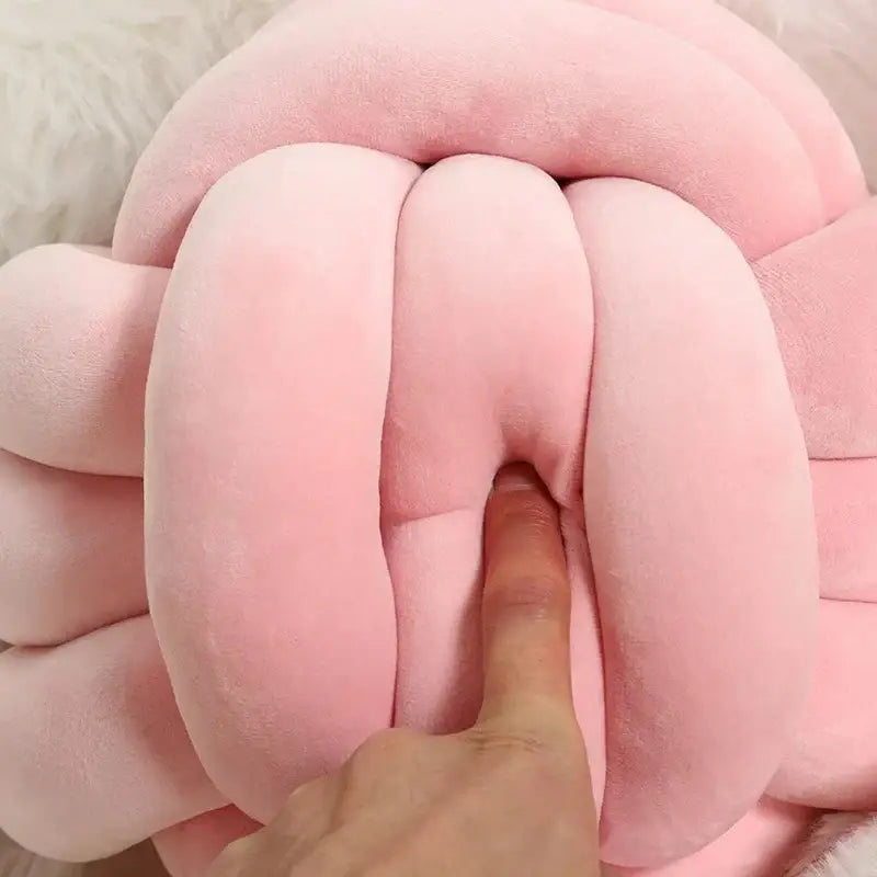 Soft pink velvet knotted ball round plush pillow shaped like a knotted ball for bedroom decor