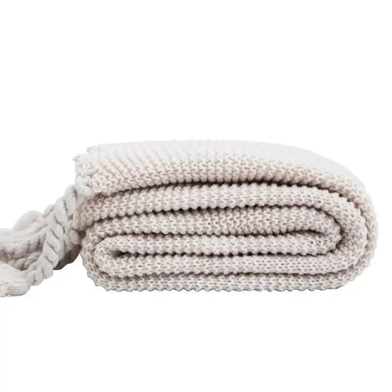 Off-white decorbites knit throw blanket with textured weave and braided tassel for bedroom decor in ivory and pink