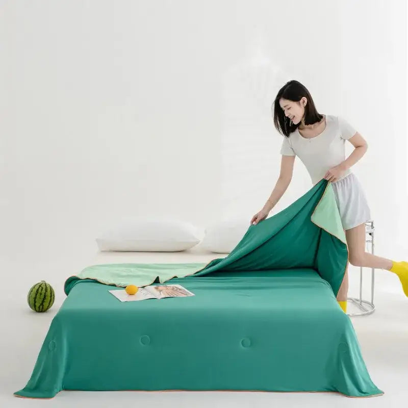 Teal two-tone reversible bedsheet with soft fabric and subtle button detailing for decorbites cool fibre summer quilt