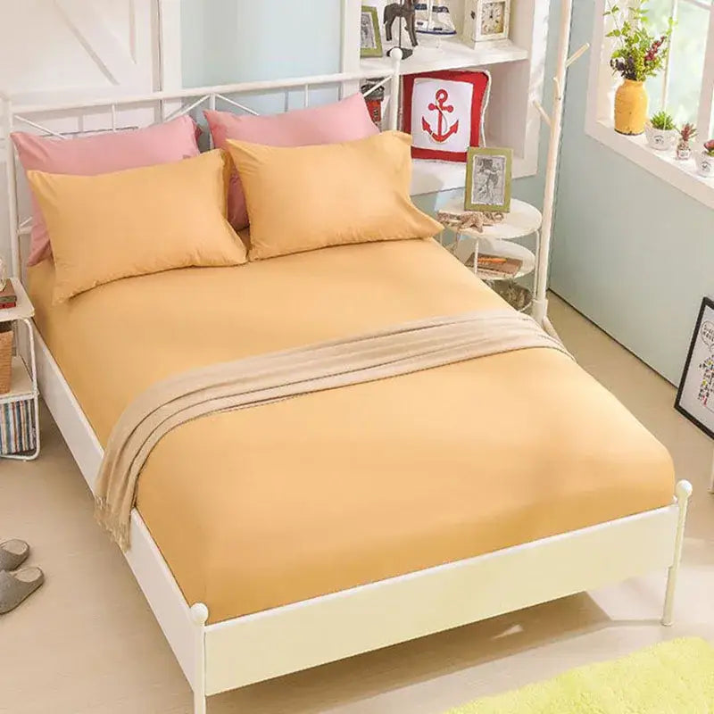 Soft mustard-yellow decorbites cotton fitted sheet with subtle sheen neatly draped for bedroom bedding decor