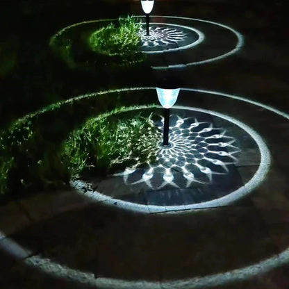 Solar light outdoor waterproof pathway garden lights with sleek black poles and white lampshades casting circular shadows