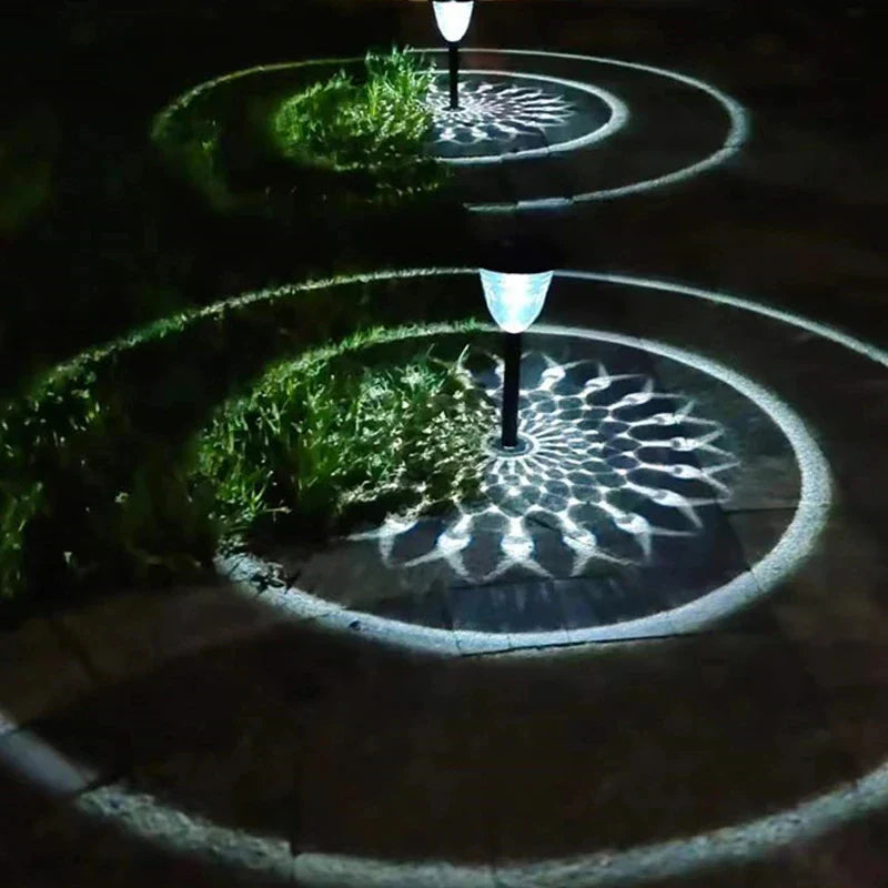 Solar light outdoor waterproof pathway garden lights with sleek black poles and white lampshades casting circle shadows