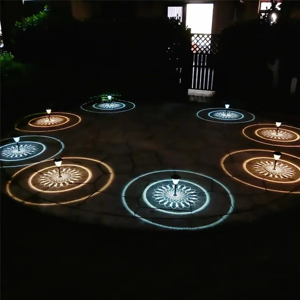 Solar light outdoor waterproof circle shadow lawn pathway light projecting amber and blue floral patterns on ground