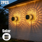 Black solar mandala projection wall sconces with intricate gold filigree casting sunburst shadows for outdoor lighting