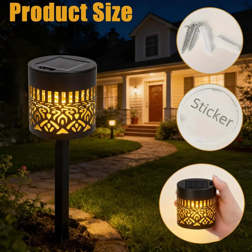 Black solar-powered garden light with gold-toned cut-out patterns cylindrical design for outdoor yard patio lighting