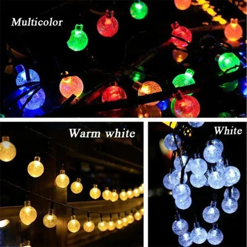 Solar string lights with multicolor warm white and white frosted glass globe bulbs for outdoor garden and party decor
