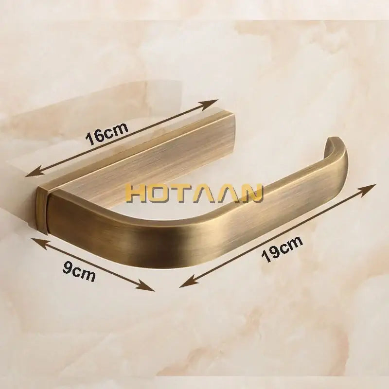 Antique solid brass finish toilet paper holder with a sleek curved design and brushed metal surface bathroom accessory