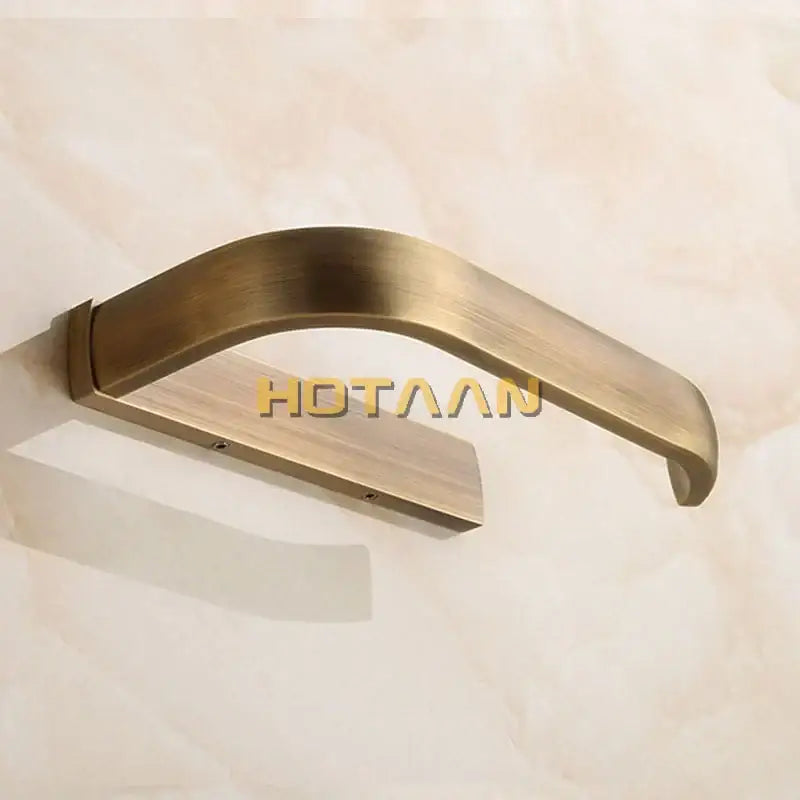 Solid brass finish toilet paper holder with brass-finished curved wall-mounted towel rack in sleek modern design