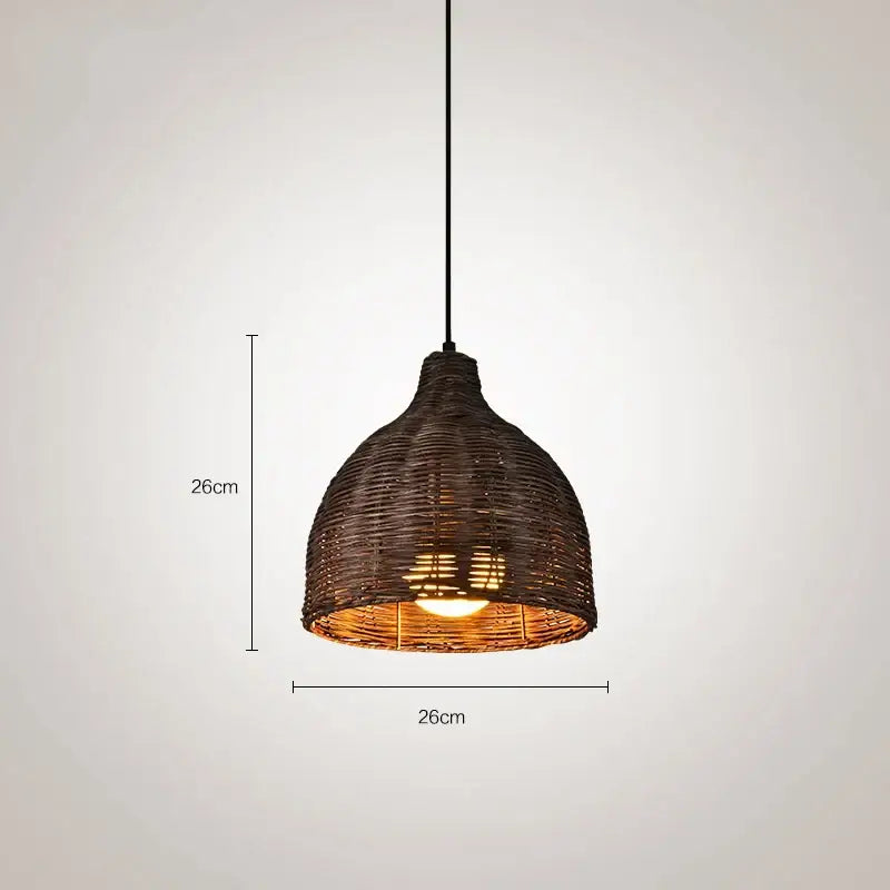 Dark brown woven rattan pendant light with warm glowing bulb for Southeast Asia natural dining room decor