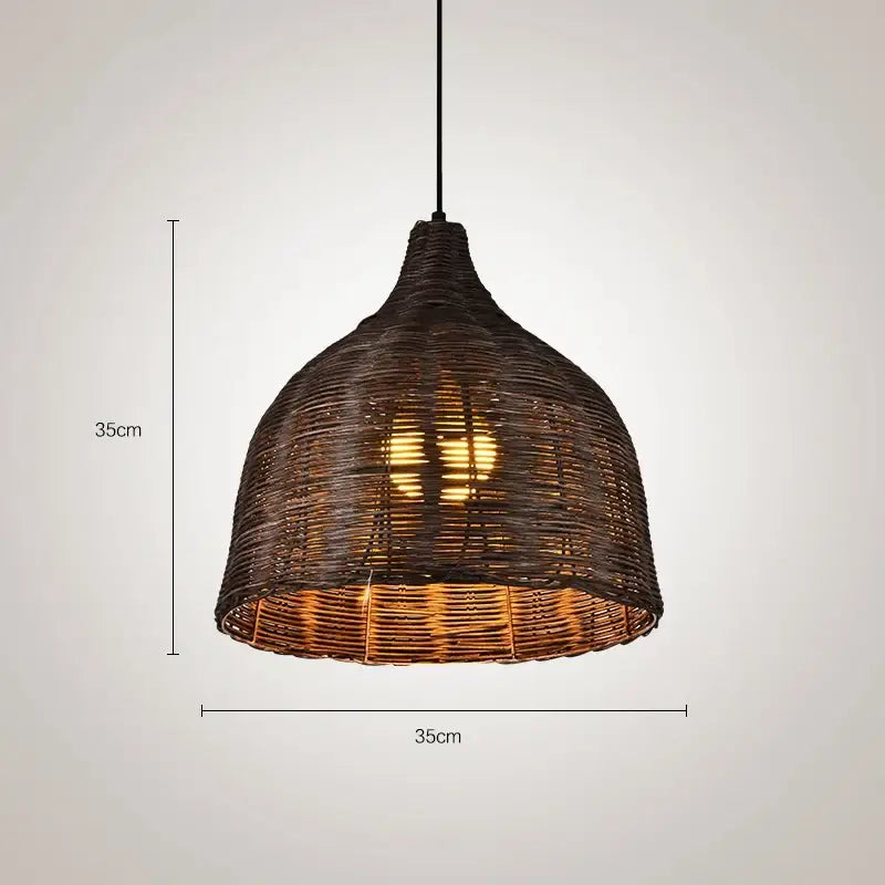 Dark brown woven rattan pendant light with warm glowing interior for southeast asia natural dining room decor