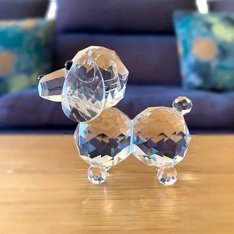 A clear faceted crystal dog figurine with black bead eyes for sparkling bedroom decor ornament