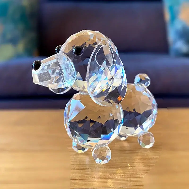 A sparkling clear crystal dog figurine with faceted transparent body and black bead eyes for bedroom decor