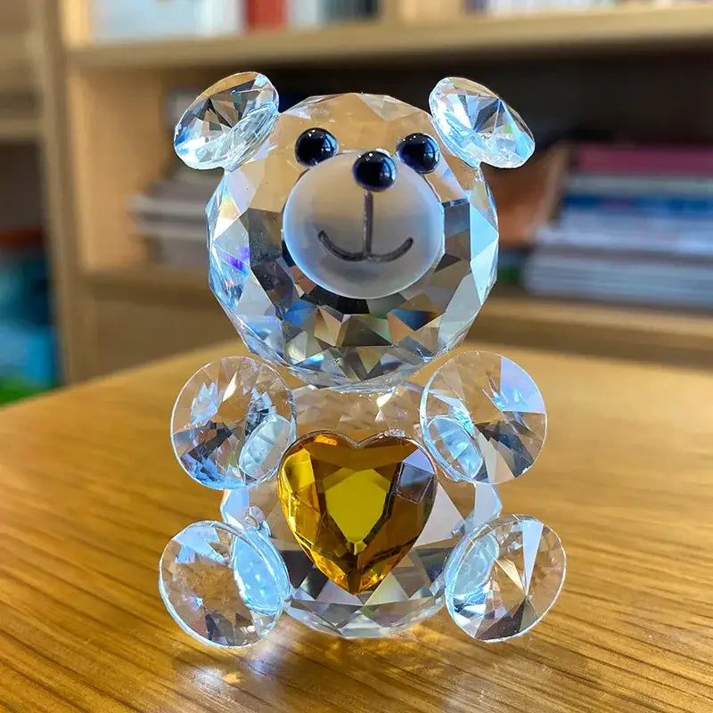 Sparkling decorbites crystal bear figurine with clear faceted body black bead eyes holding golden heart gem for bedroom decor