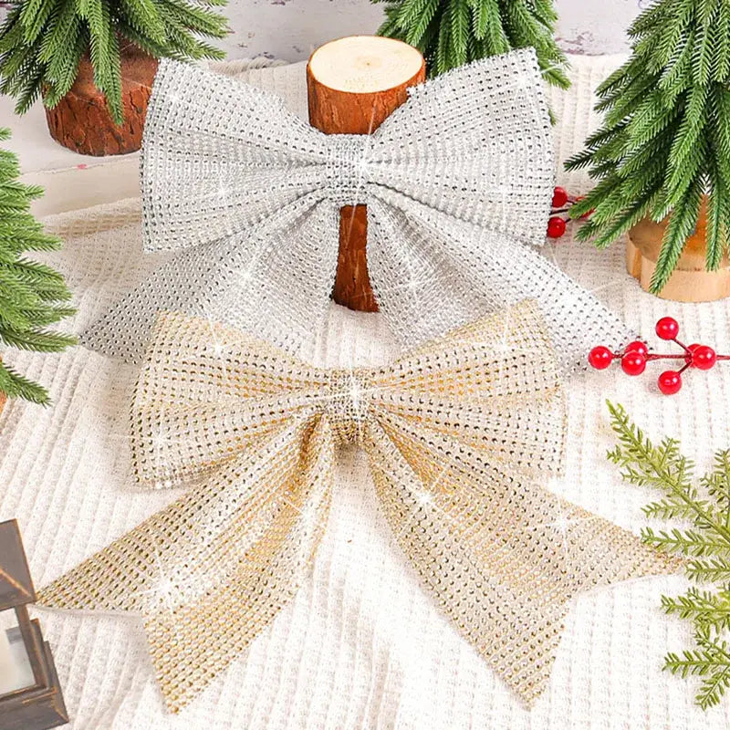 Shiny silver and gold rhinestone embellished diamond bow pendant for holiday tree decor in living room