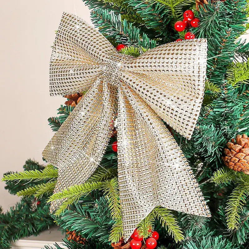 A shimmering gold diamond bow pendant with a sparkling mesh crystal pattern for holiday tree decor