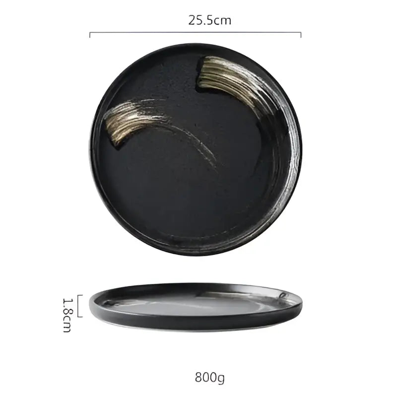 Speckled black and white decorbites ceramic round dinner plate with glossy finish and gold brushstroke design