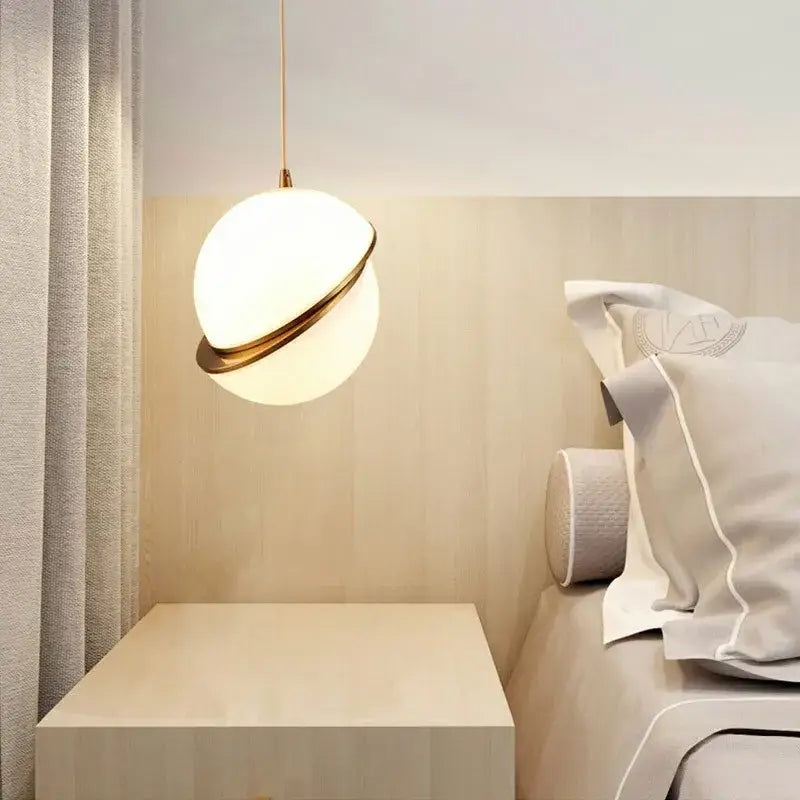 A spherical white and gold lustre pendant light with frosted glass globe and gold lustre led ring for living room decorbites gold lustre