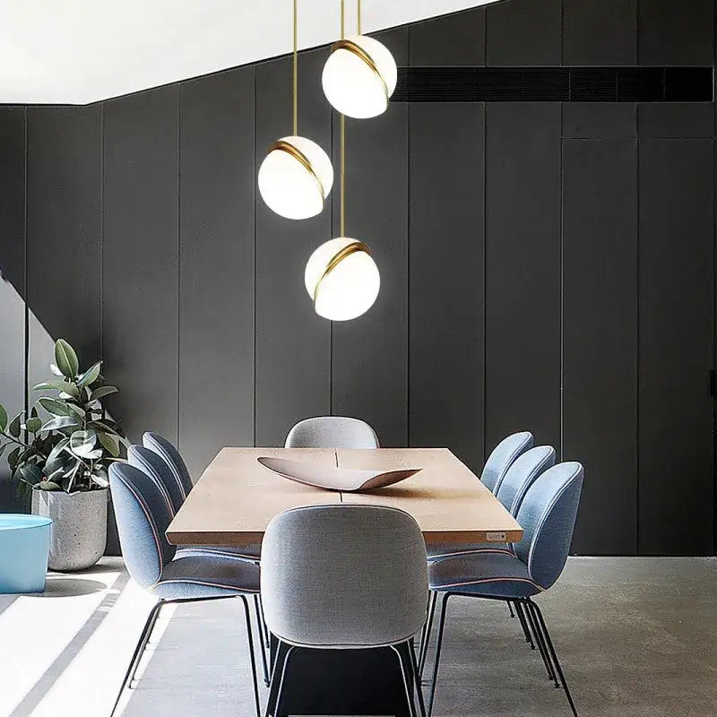 Modern pendant lights with spherical white glass shades and gold lustre led metal accents for living room decorbites gold lustre
