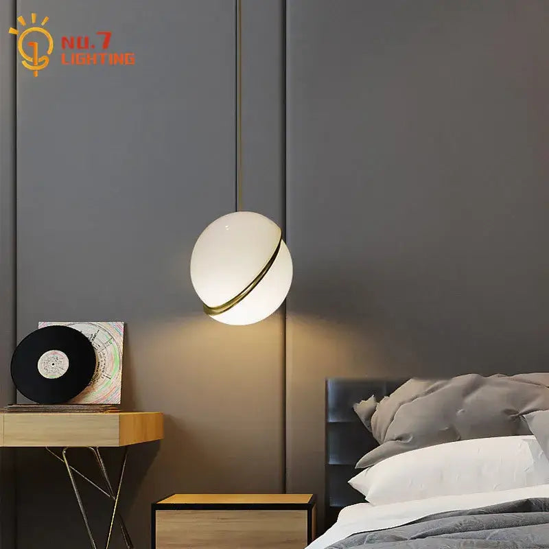 A spherical white glass pendant light with gold lustre led ring accent for living room decorbites pendant lights