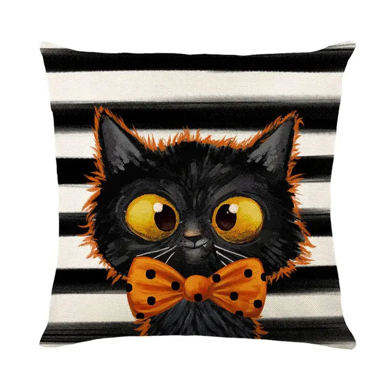 Spooky halloween pumpkin linen cushion featuring black and orange cat with polka-dotted bow tie on striped background