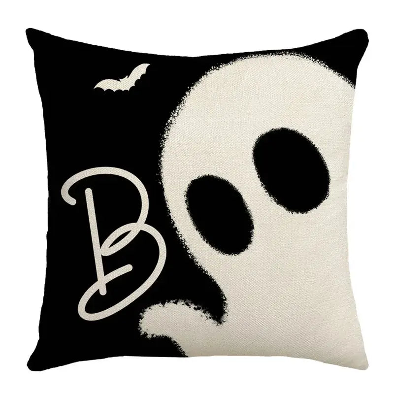 Black and white halloween pumpkin linen throw pillow featuring ghost design and cursive boo for living room sofa