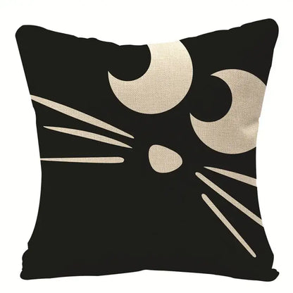 Black linen cushion cover featuring a minimalist beige cat face with crescent eyes for halloween pumpkin linen decor